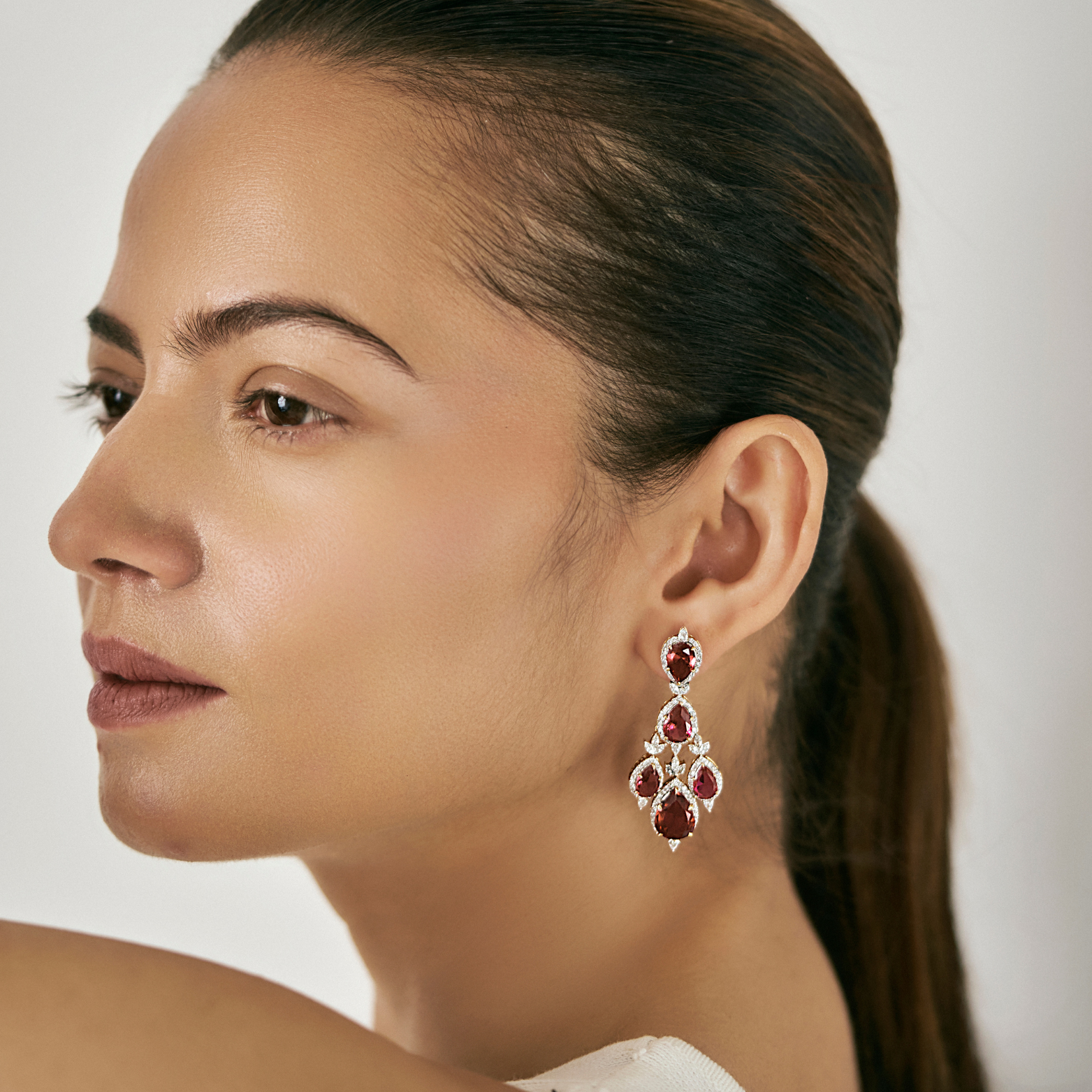 Ruby Pear Lab Diamond Dangle Earrings - model face view in 9KT